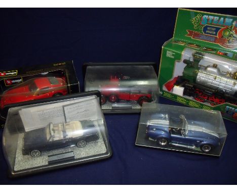 Boxed unopened steam engine battery operated train, a boxed BBURAGO collectors model Ferrari 250GTO 1962 and three other case