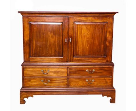 A GOOD QUALITY GEORGE III PERIOD IRISH MAHOGANY CUPBOARD ON STAND, the moulded top above two panelled doors, enclosing pull-o