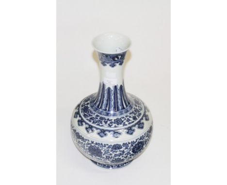 A GOOD CHINESE BLUE AND WHITE BULBOUS BOTTLE VASE, decorated all over with scrolling foliage and flowers, on a circular stem 