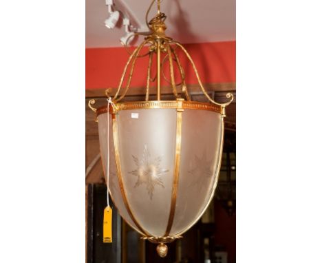 AN ATTRACTIVE BRASS AND FROSTED GLASS LANTERN, in the form of an acorn, with six leaf crest scroll suspenders and six shaped 