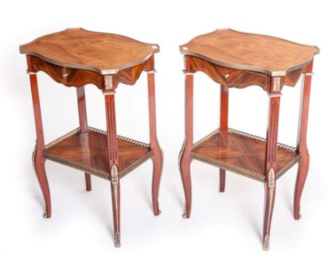 A PAIR OF BRASS MOUNTED SERPENTINE SHAPED MAPLE TOPPED LAMP TABLES OR OCCASIONAL TABLES, each top with moulded brass edge aro