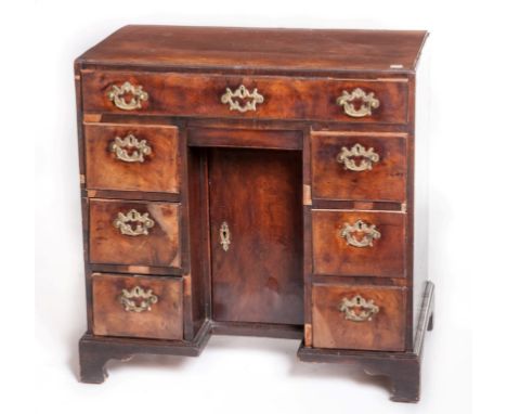 A GEORGE III PERIOD MAHOGANY KNEEHOLE BACHELOR'S DESK, with one long frieze drawer, above a  lower smaller concealed door, an