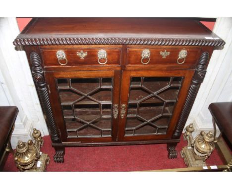 AN IRISH REGENCY PERIOD INLAID MAHOGANY DWARF SIDE CABINET, probably Cork, the cross banded top with a gadroon or rope edge, 