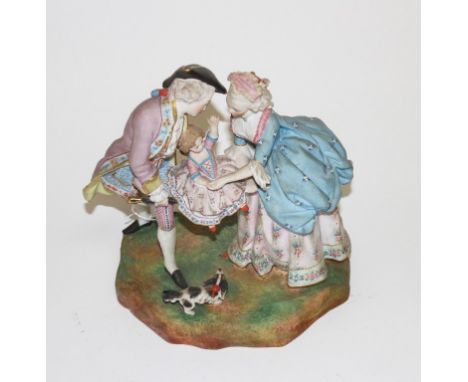 A GERMAN BISQUE GROUP, modelled with two parents playing with young girl and a terrier by their feet, 10" (25cm). (1) 