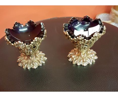A GOOD PAIR OF WILLIAM IV SILVER AND SILVER GILT GOTHIC STYLE STEMMED SALTS, by H.Y Wilkinson & Co. Sheffield 1939, each pier