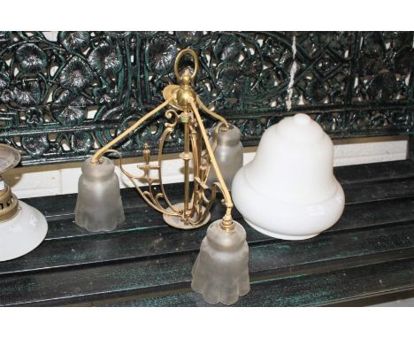 A THREE-BRANCH ART NOUVEAU BRASS CEILING LIGHT, with three frosted glass shades, 17.5" (45cm)h; together with another brass-m