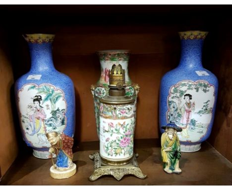 A PAIR OF CHINESE ENAMEL VASES,in blue, white and yellow, each decorated with panels depicting women in landscapes, 10.5" (27