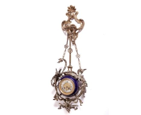 A VERY UNUSUAL FRENCH SUSPENSION BRASS AND PORCELAIN CLOCK, with rococo style cartouche shaped bracket, the chain suspenders 