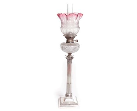 A FINE SILVER COLUMN OIL LAMP, London 1910, with half reeded fluted column, with corinthian capital, on a square gadroon moul