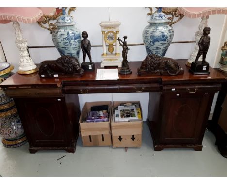 A NINETEENTH CENTURY INLAID MAHOGANY PEDESTAL SIDE BOARD, of inverted breakfront outline, the back with brass rail, urn finia