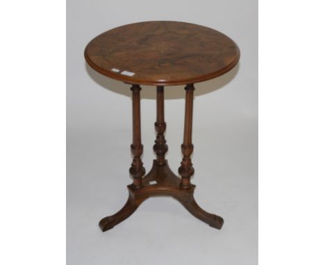 AN ATTRACTIVE VICTORIAN INLAID AND FIGURED WALNUT CENTRE OCCASIONAL TABLE, with circular moulded top, raised on three fluted 