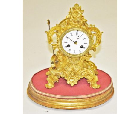 A SMALL FRENCH ROCOCO STYLE BOUDOIR MANTEL CLOCK, the lever movement striking on a brass bell, the enamel dial with Roman num