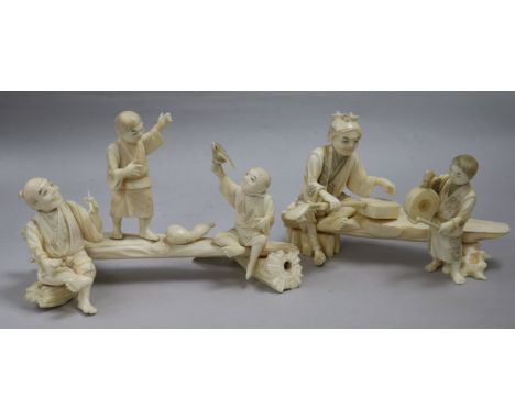 Two Japanese sectional ivory groups of figures on benches, early 20th century,