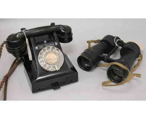 A vintage black Bakelite telephone and pair of Ross WWII Bino Prism No. 5 Mk 3x7 binoculars, with broad arrow mark, stamped '