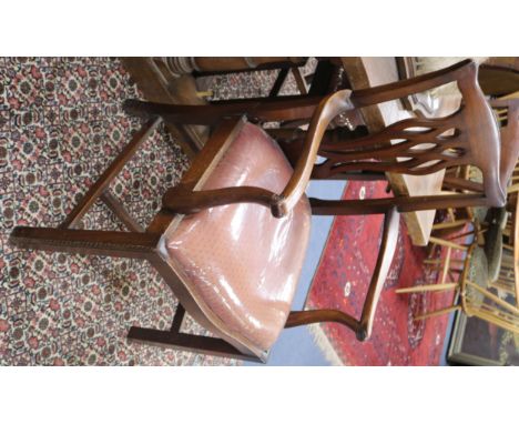 A set of seven Chippendale style dining chairs