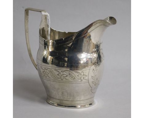 A George III engraved silver helmet shaped cream jug, marks rubbed, 3 oz.