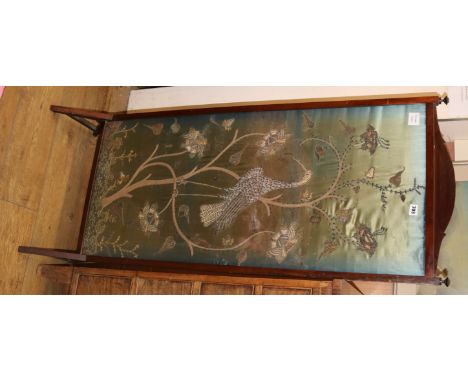 A silver threadwork panel firescreen