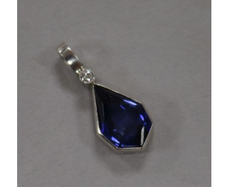 A white metal, synthetic sapphire and diamond set pendant, 20mm.