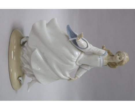 A Lladro figure of a girl height 25cm
