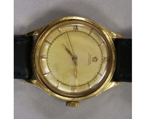 A gentlemen's 1940's Omega 18ct gold automatic wristwatch, having champagne dial with Roman numerals at the quarters and swee