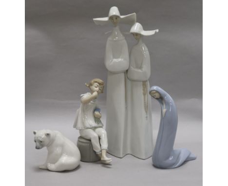 A tall Lladro group of two nuns, glazed in white and three other Lladro figures, including Girl with Lipstick and Doll, No. 1