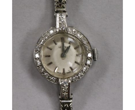 A lady's 1960's 18ct white gold and diamond set Vertex manual wind cocktail watch, on a 9ct white gold double strand bracelet