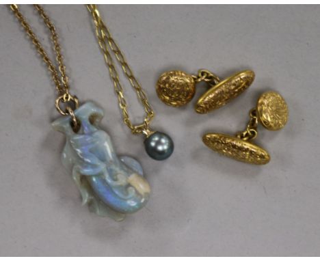 A pair of 10K gold engraved oval cufflinks and two 9ct gold neck chains and pendants, one with a blue Akoya pearl pendant, th