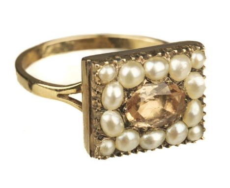 * Ring. A George III yellow metal ring, set with a citrine surrounded by 14 pearls in a rectangular setting, size P/Q, gross 