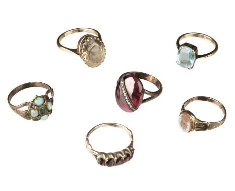 * Rings. A mixed collection of dress rings, including a 9ct gold ring set with a pale citrine, size N, another 9ct ring set w