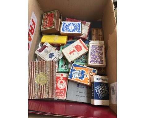 Box of various playing cards and games 
