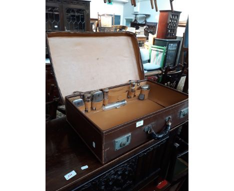 Vintage suitcase with fitted grooming kit 