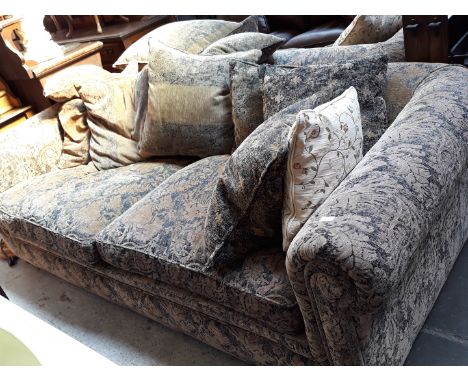 A large Chesterfield style 4 seater sofaCondition: No signs of any damage, minor wear to arms, fading from sun light to rear 