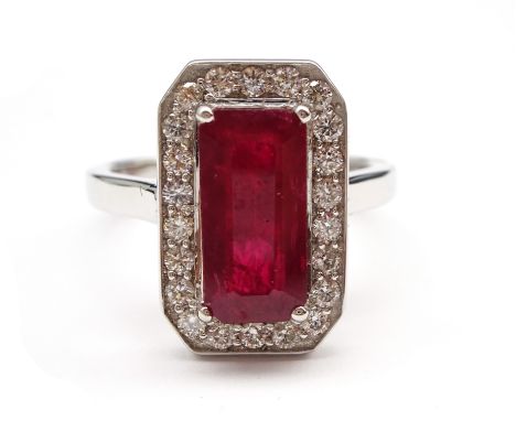 18ct white gold emerald cut ruby and round brilliant cut diamond cluster ring, hallmarked, ruby approx 2.60 carat Condition R