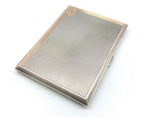 Engine turned silver cigarette case with gilded interior and inscription 'Portland Lodge, Harrogate' London 1935 and in leath