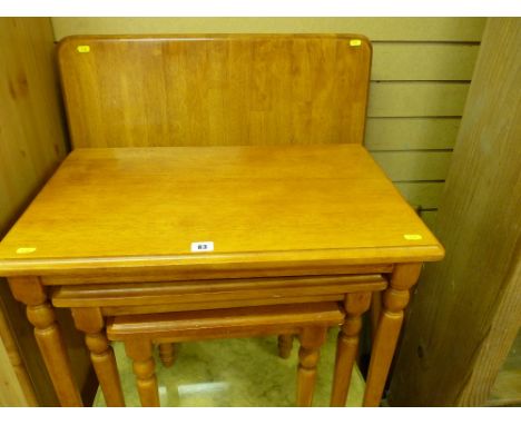 Light wood oblong breakfast table and a similar nest of three coffee tables