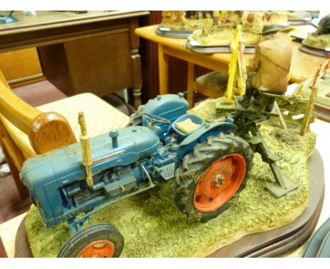 Border Fine Arts model of a farmer at work with blue tractor, sculptor Ayres, no certificate