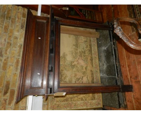 An early 20th century oak fire surround incorporating a mantel shelf, W. 117cm.