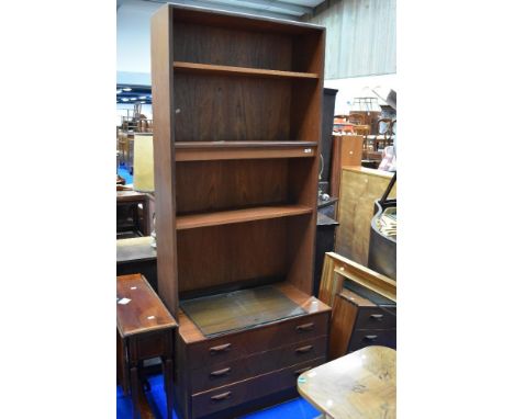 A vintage teak wall unit having partially glazed shelves and drawer base, dimensions approx. H198cm W82cm D46cm , labelled G 