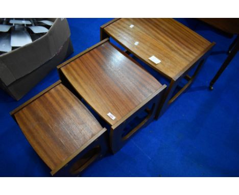 A vintage G plan style nest of three tables