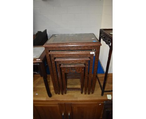 A vintage oriental nest of three tables