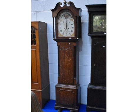 A 19th Century oak longcase clock having mahogany cross banding, with 8 day movement and painted dial, named for Wm Bucknall,