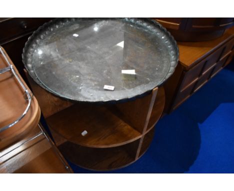 An mid 20th Century golden oak circular shelf table on castors, with adapted Copper table top (probably 19th century) and cir