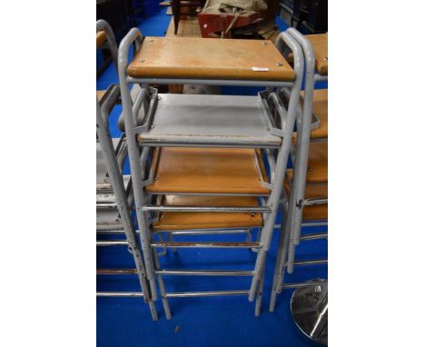 A set of four vintage school or similar lab or workshop stools