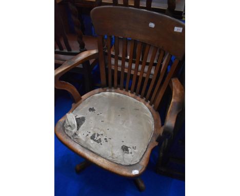 A vintage stained frame swivel office chair