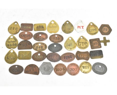 A collection of assorted railway employee and pay cheque tags, largely GWR (Great Western Railway) and CWR marked, some marke