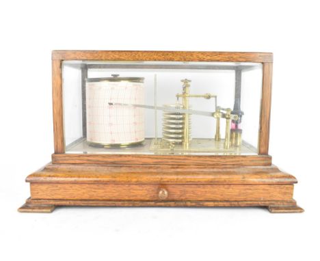 An early 20th-century oak cased barograph by Ross Ltd, London, housed within a rectangular glazed case with a single drawer c