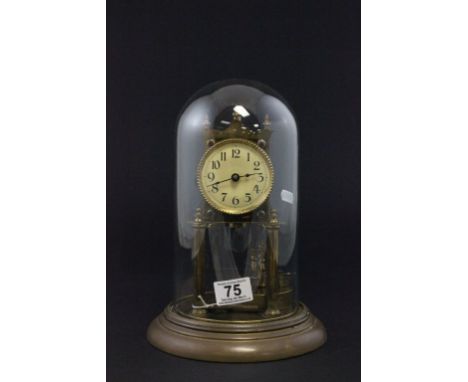 A 20th century clock in a glass dome 