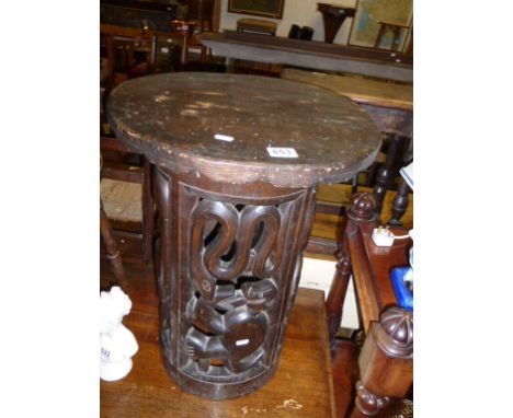 Ethnic Tribal Hardwood Circular Table, the base hollow carved from a single trunk with animals and birds