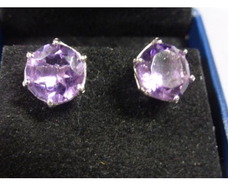 Pair of silver and large amethyst stud earrings