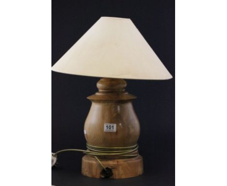 A carved modern walnut lamp